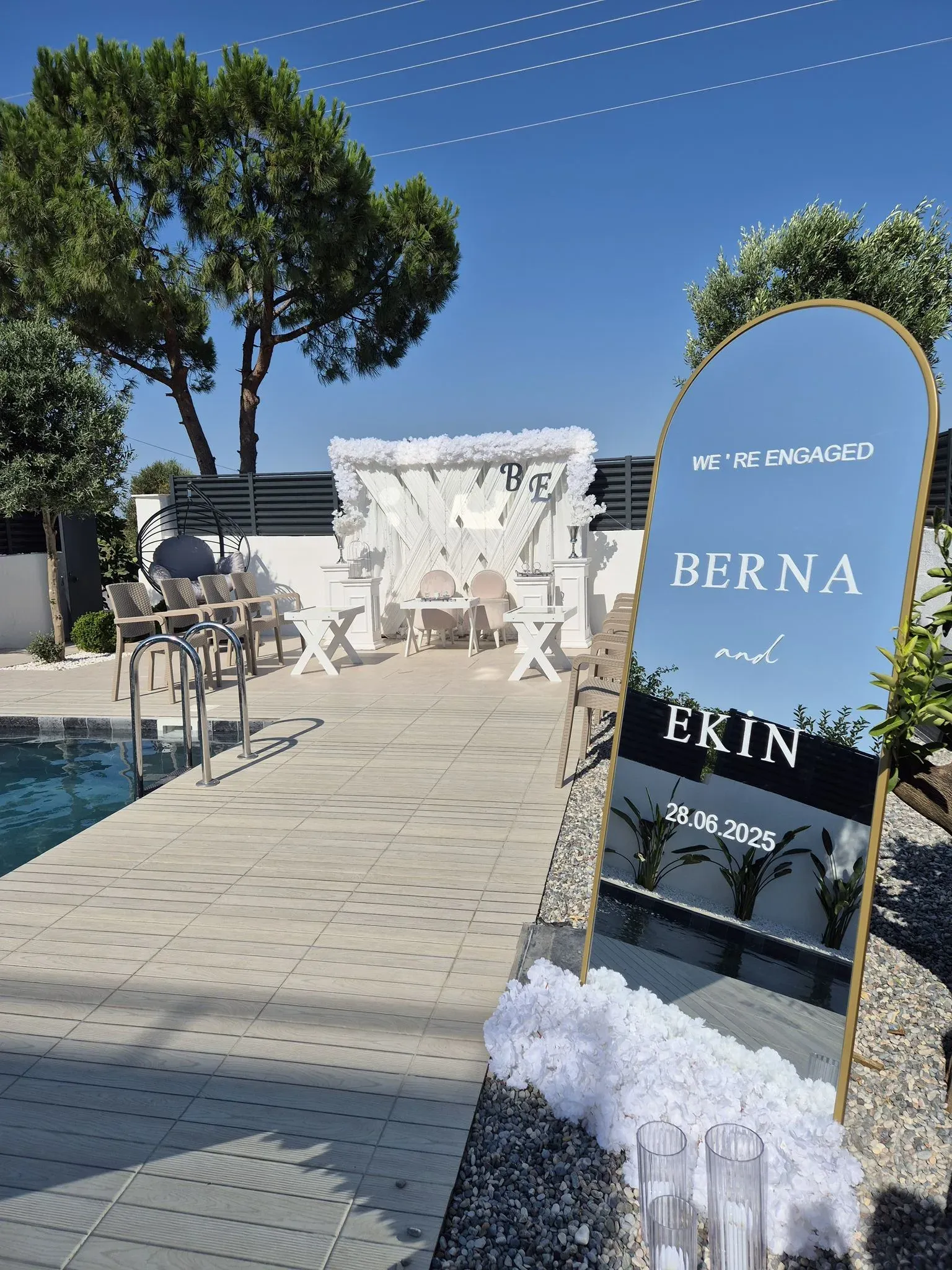 Engagement ceremony backdrop with Berna & Ekin welcome sign by the pool